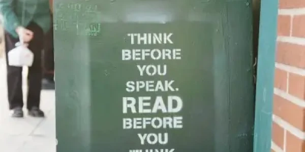 Stock image of a book cart with print "Think before you speak. Read before you think.