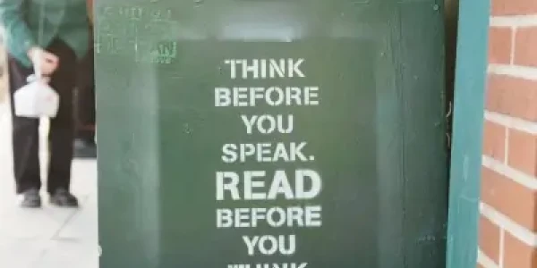 Stock image of a book cart with print "Think before you speak. Read before you think.